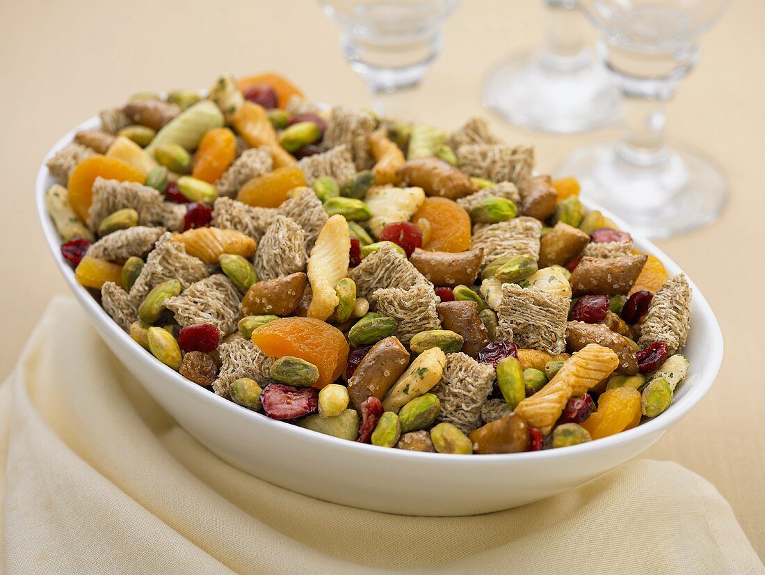 Large Bowl of Trail Mix Made with Pistachios, Shredded Wheat and Dried Fruit