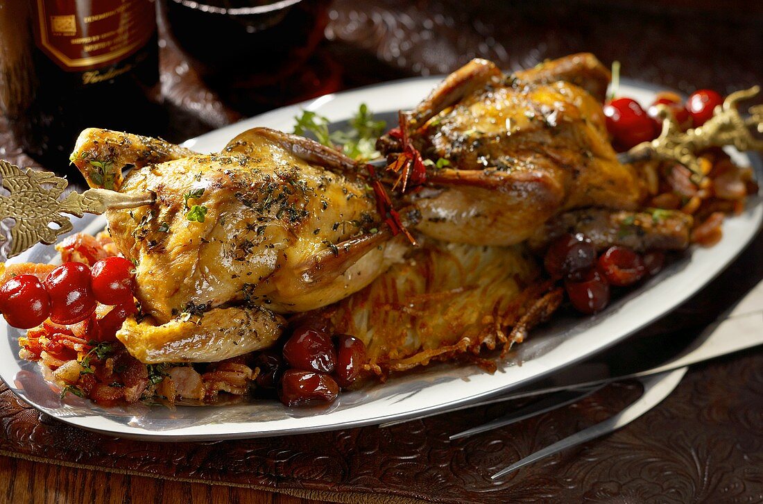 Roasted Squab Served on a Platter with Cherry Tomatoes