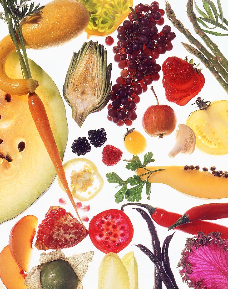An arrangement of fruit and vegetables on a glass platter