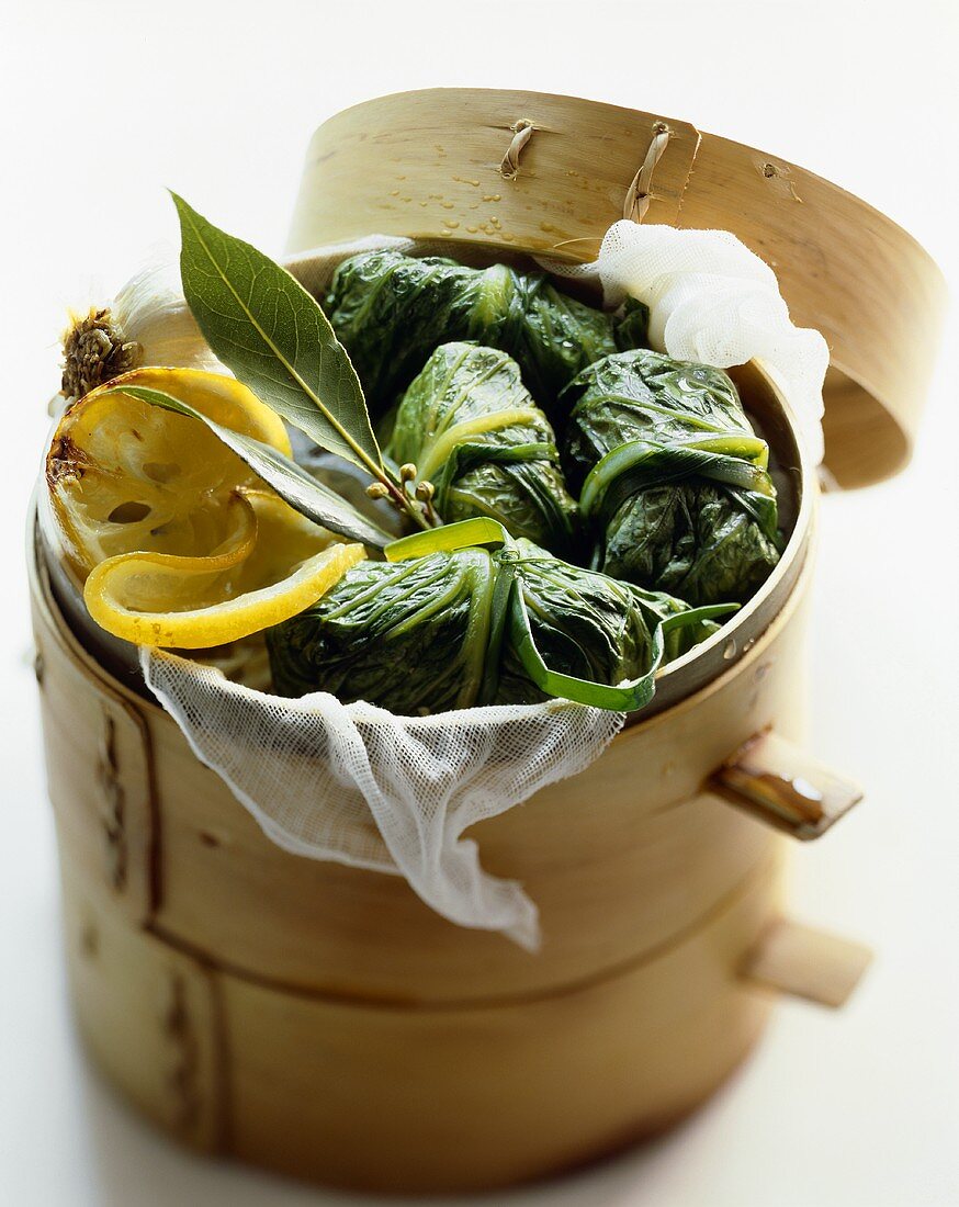 Chicken Filled Cabbage Bundles in a Bamboo Steamer