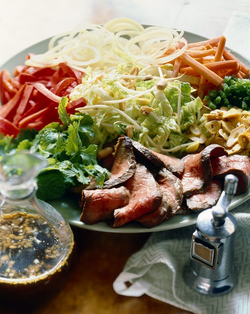 Salad Platter with Sliced Steak; Small Pitcher of Dressing