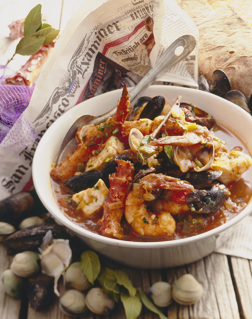 Bowl of Seafood Stew with Spoon, Shellfish with Newspaper