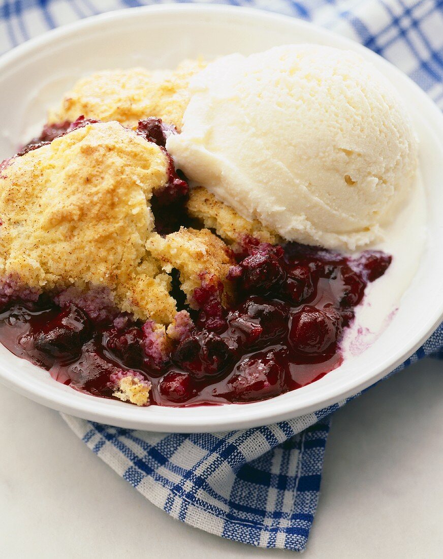 Bowl of Blueberry Cobbler with a Scoop of Vanilla Ice Cream