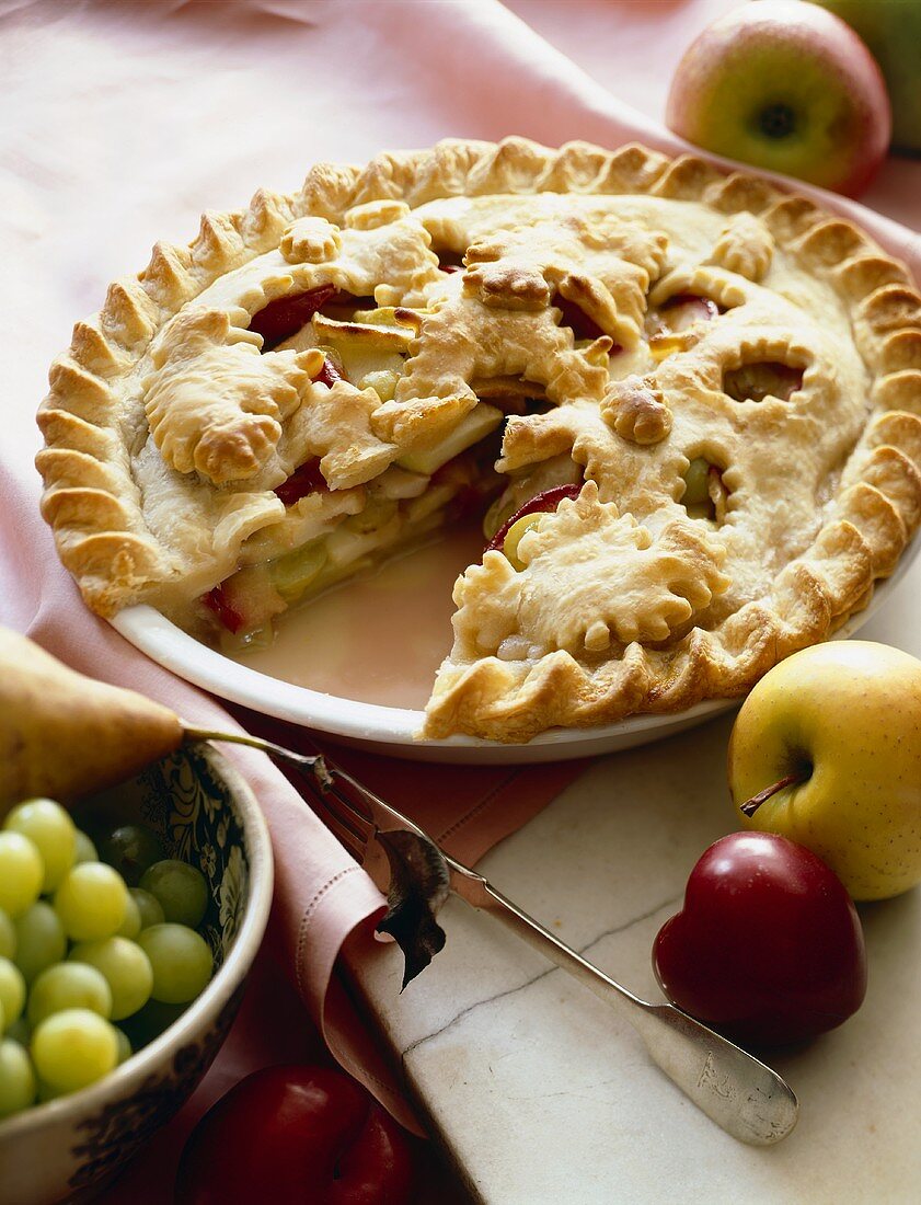 Fruit Pie with Apples, Plums and Grapes; Slice Removed