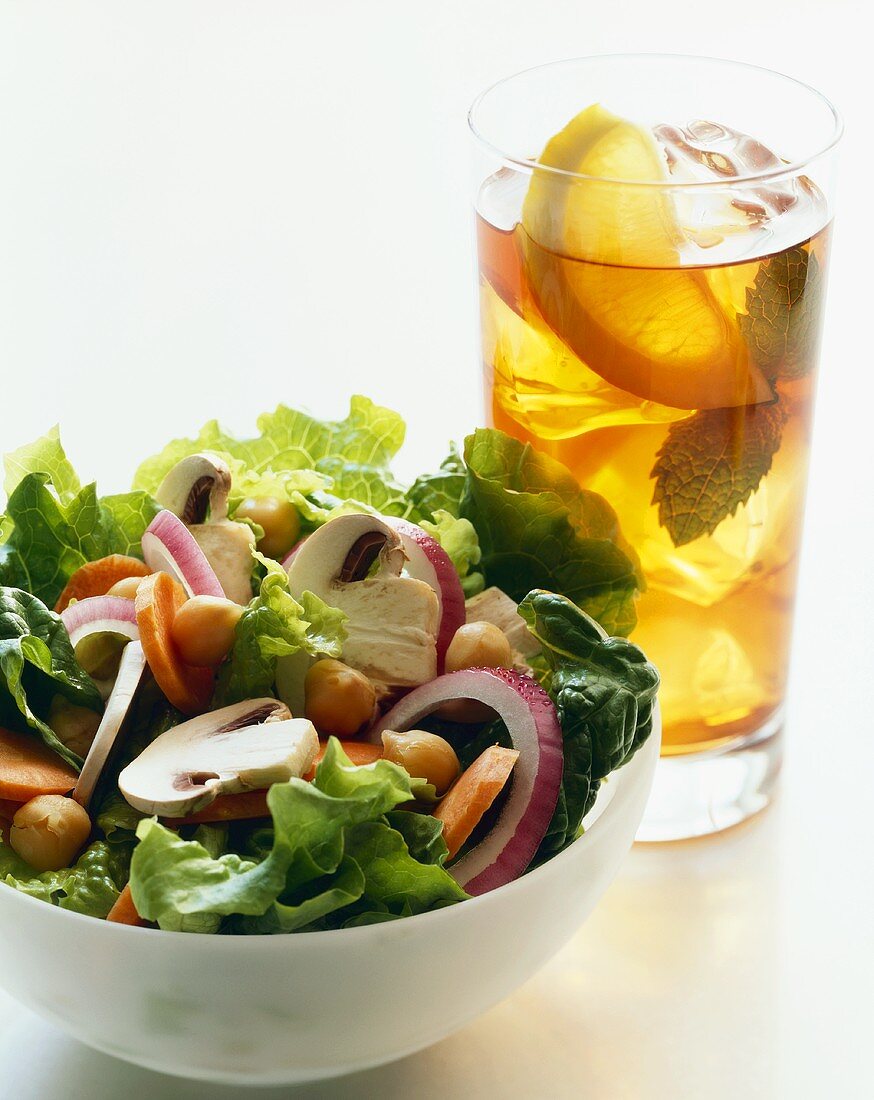 Bowl of Chopped Salad with a Glass of Iced Tea