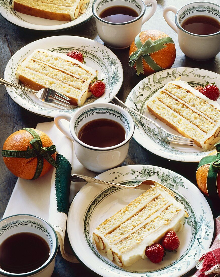 Servings of Layered Almond Cake with Cups of Coffee; Holiday Dessert
