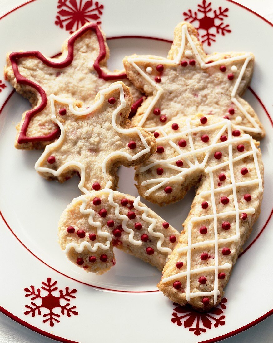 Decorated Candy Cane and Snowflake Cookies on a Snowflake Plate