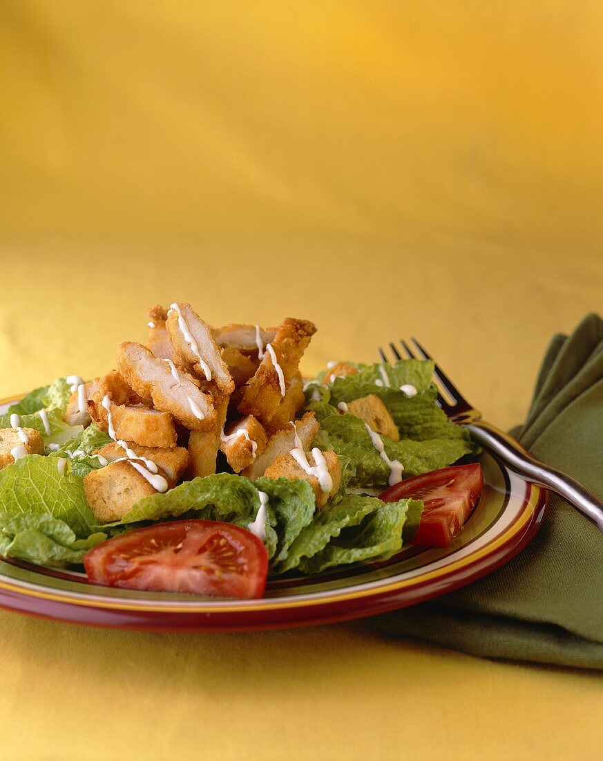 Fried Chicken Salad with Dressing and Tomatoes