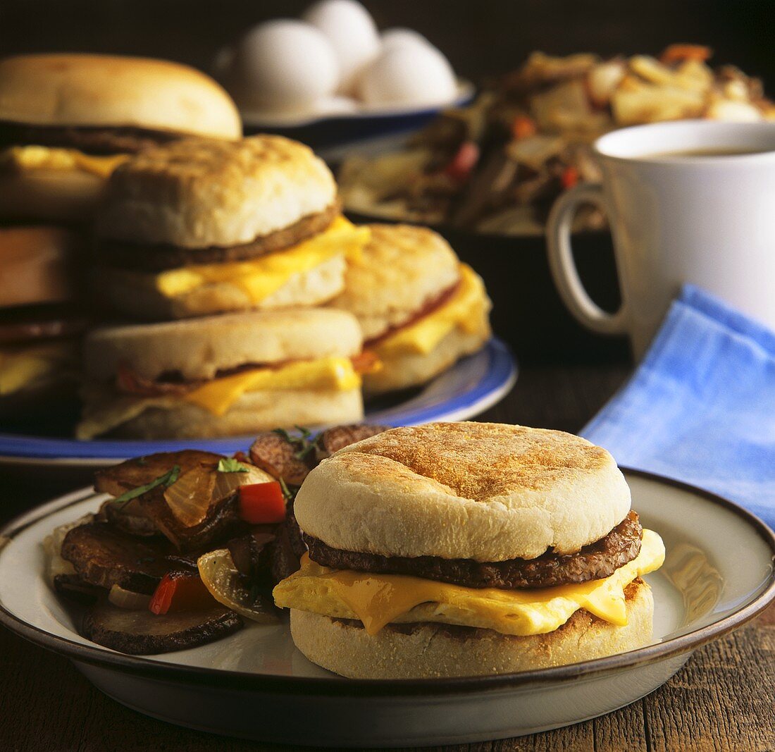 Egg and Sausage Breakfast Sandwich; Many Sandwiches on a Plate; Coffee
