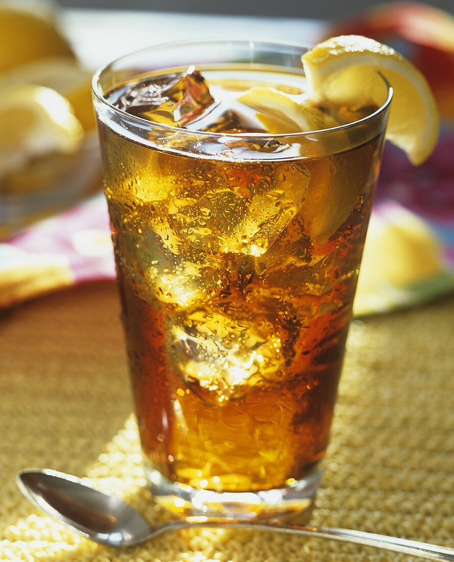 Glass of Iced Tea with Ice and Lemon Garnish