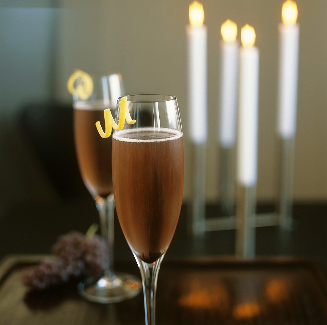Two Glasses of Champagne with Lemon Twists; Candles