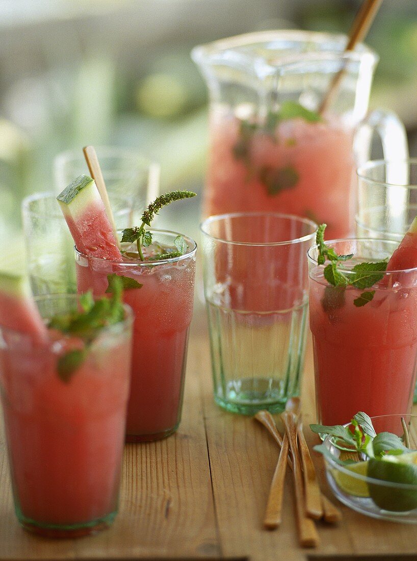 Watermelon Coolers in Glasses and Pitcher on Wooden Table
