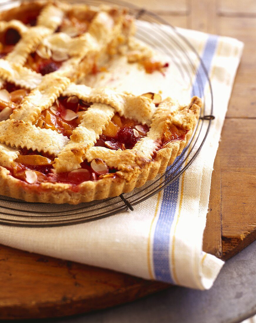 Raspberry Peach Pie with Almonds and Lattice Crust; Slice Removed