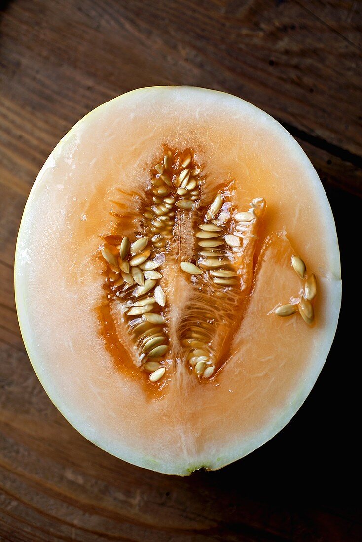 Half a Cantaloupe on Wooden Counter Top