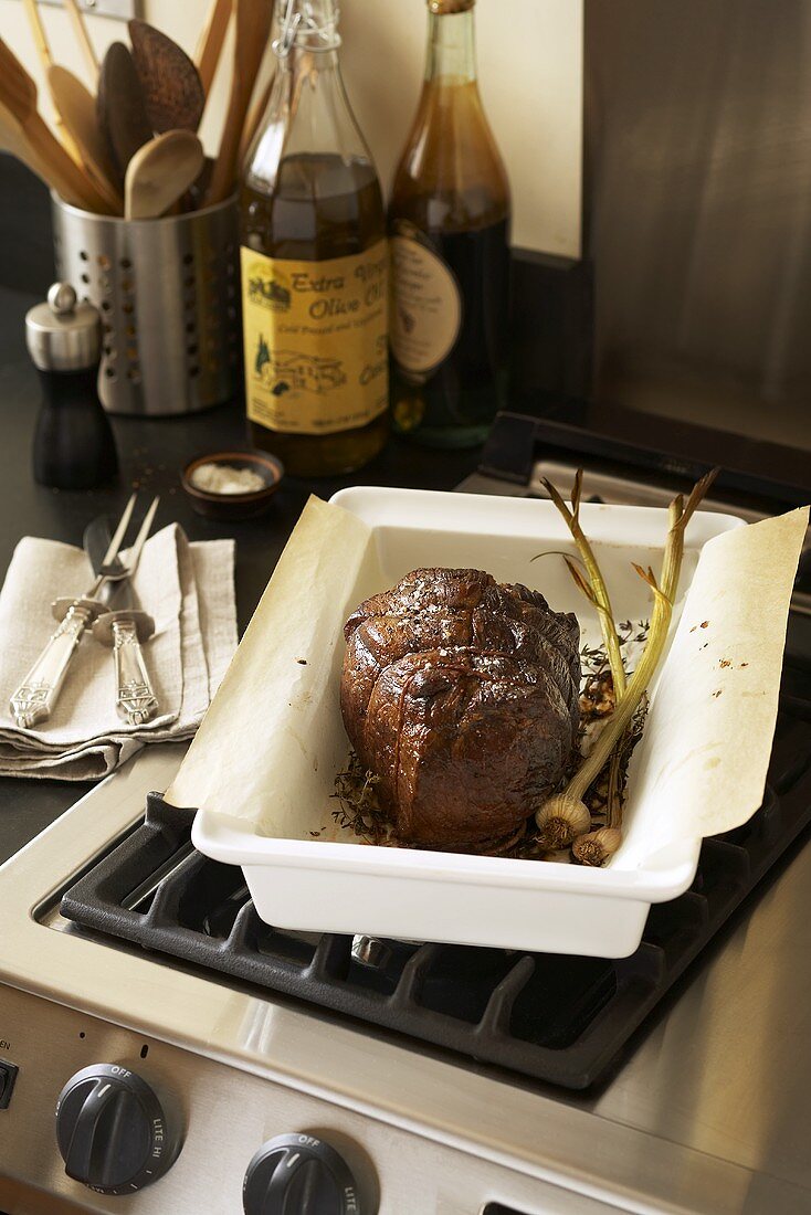Roast beef fresh out of the oven in a roasting dish