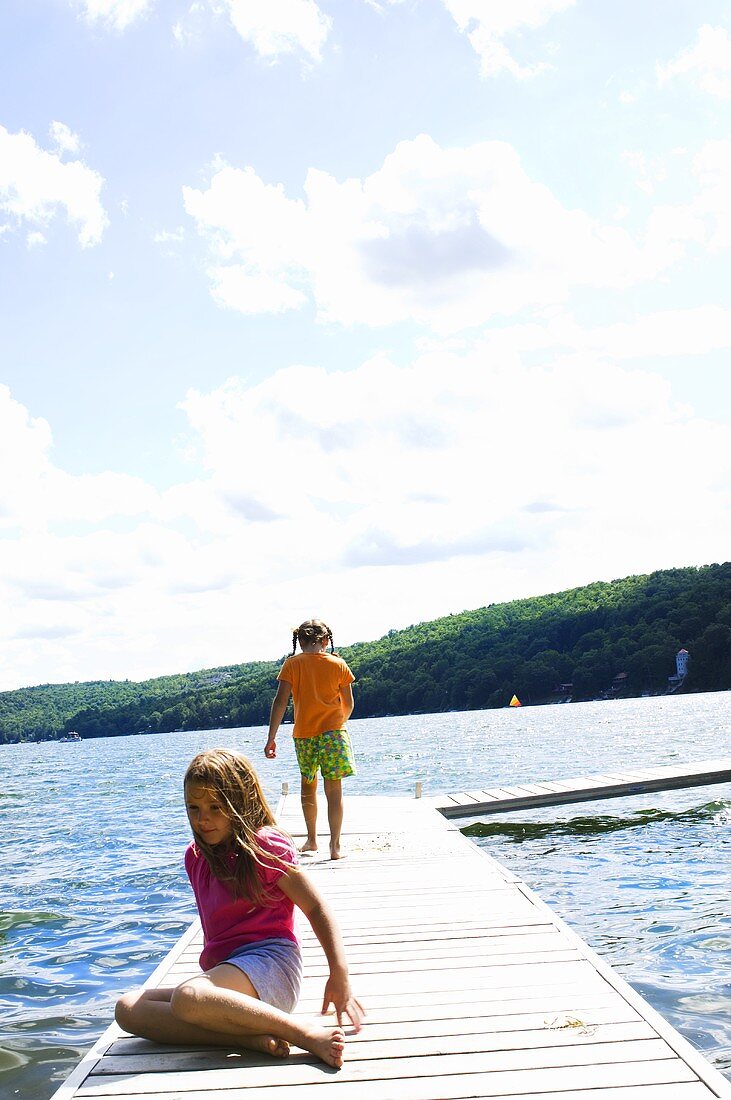 Young Girls on a Dock in a Lake