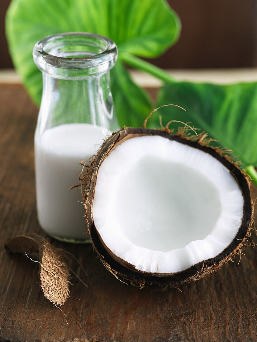 Half a Coconut with a Bottle of Coconut Milk