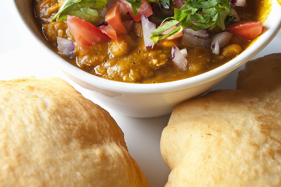 Bowl of Chole with Bhatura (Chickpea Curry with Fried Indian Bread)