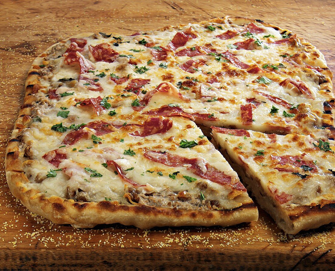 Smoked Salami Pizza on Cutting Board; Sliced