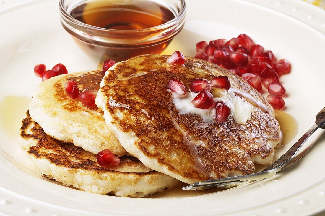 Pancakes with Pomegranate Seeds, Butter and Syrup