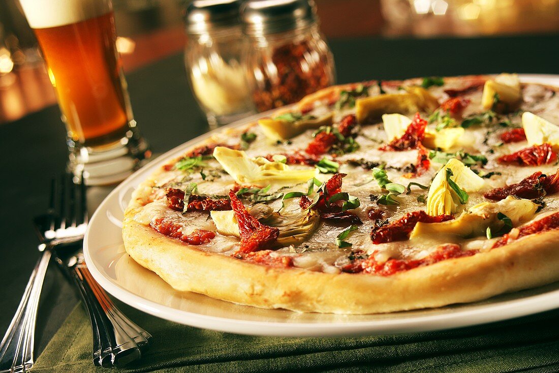 Sundried Tomato and Artichoke Pizza; Glass of Beer