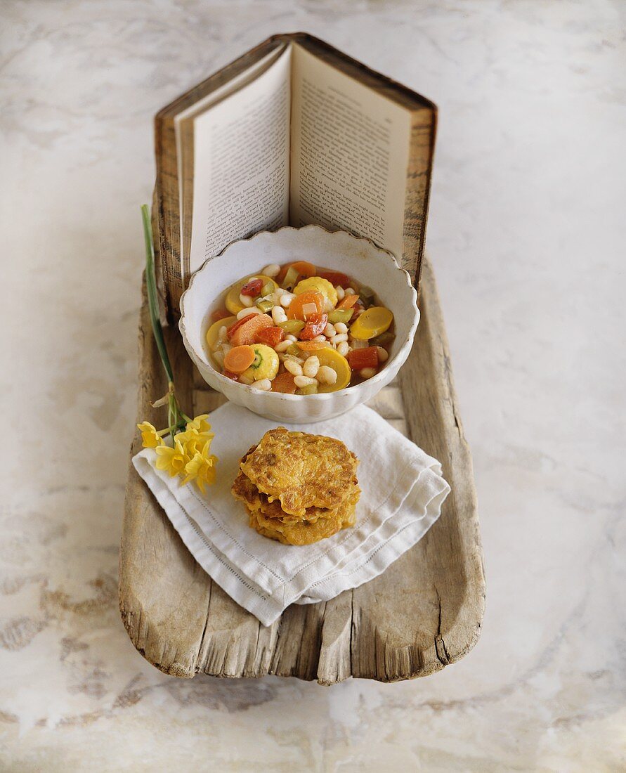 Bowl of Vegetable Soup with Potato Pancakes; Book; On Rustic Tray