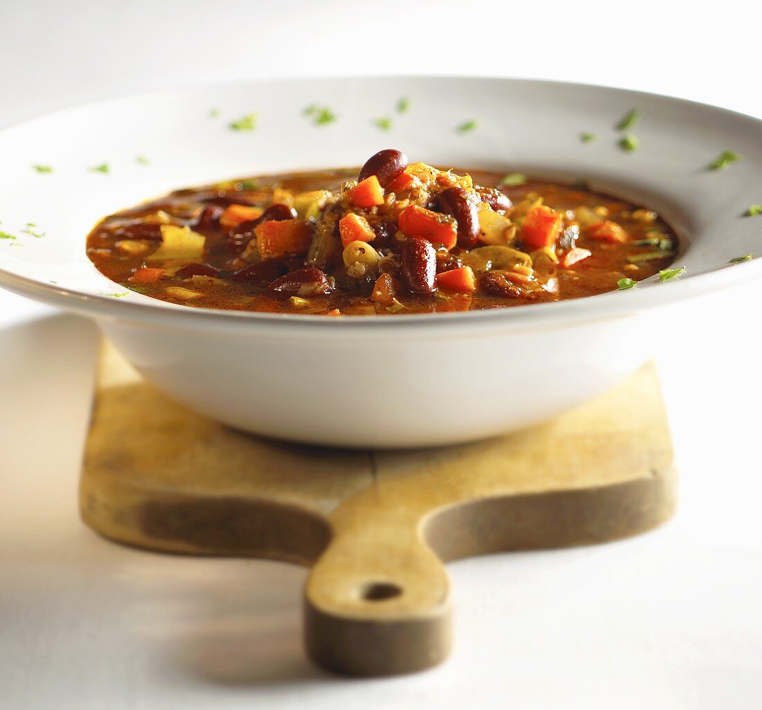 Bowl of Red Bean Chili on Cutting Board