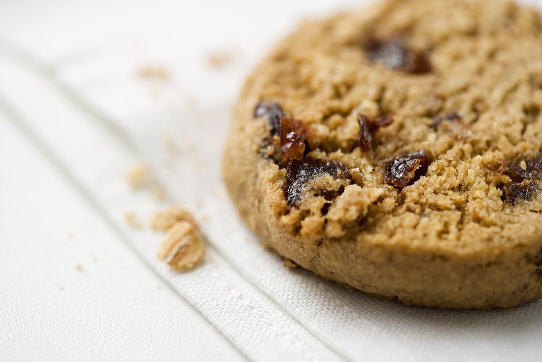 Oatmeal Raisin Cookie on White Napkin; Close Up