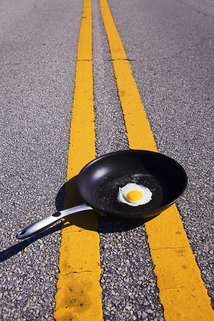 Fried Egg in Skillet in Middle of the Road