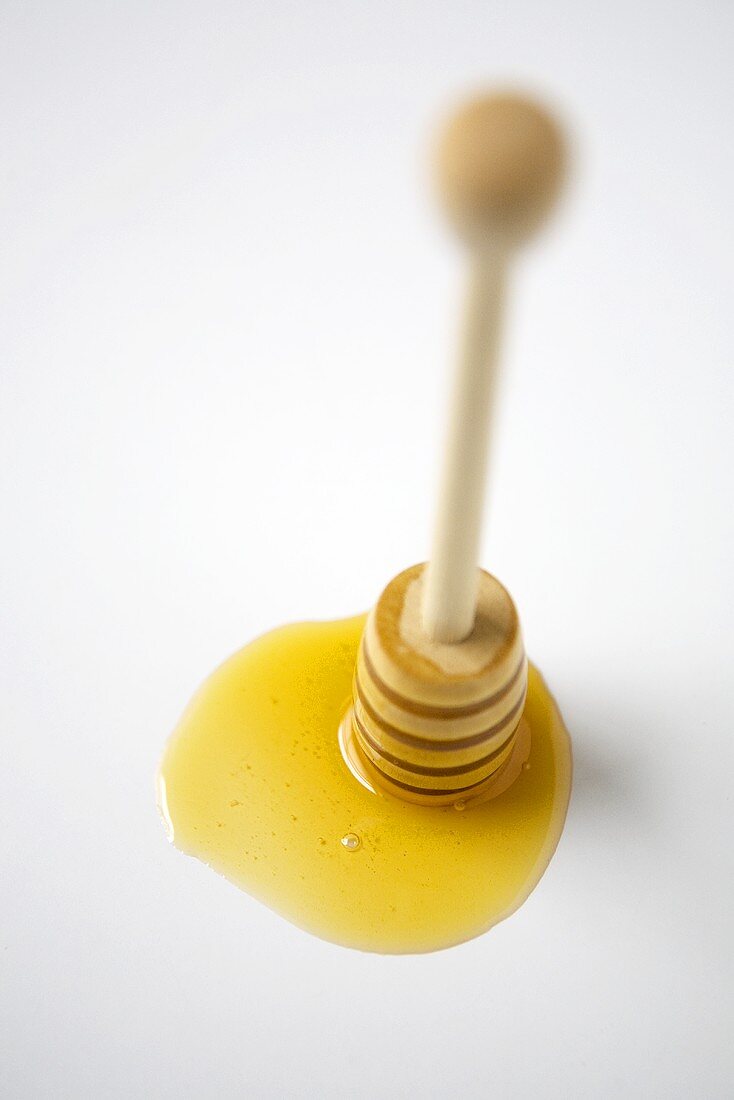 Honigklecks mit Honiglöffel