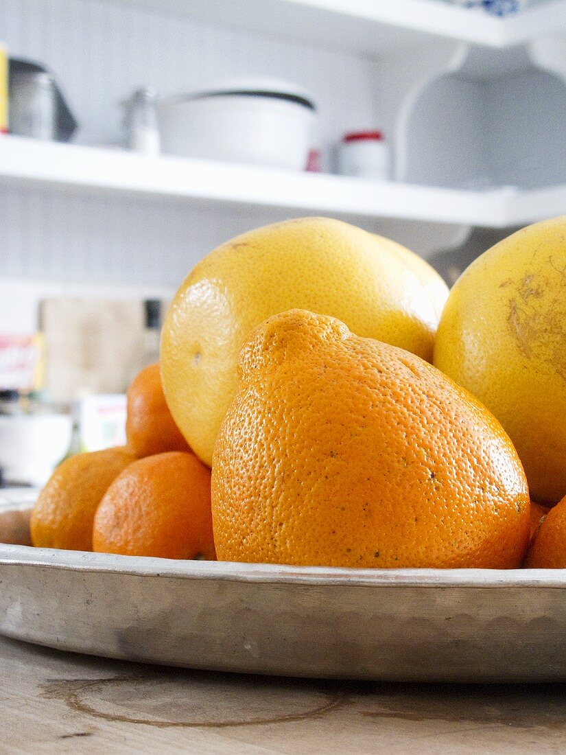 Assorted Citrus Fruit in a Dish on a Kitchen Counter