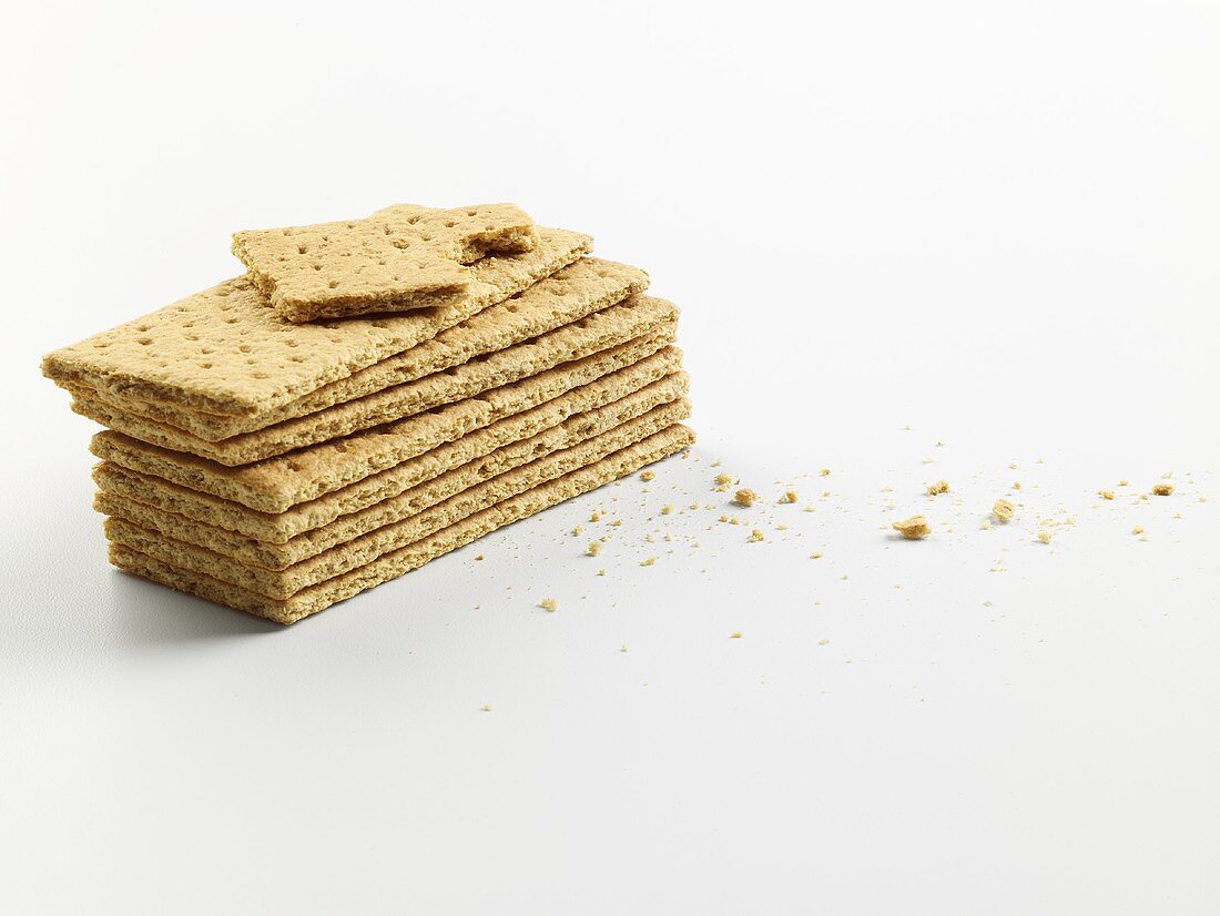 A stack of crispbreads, one with a bite taken out