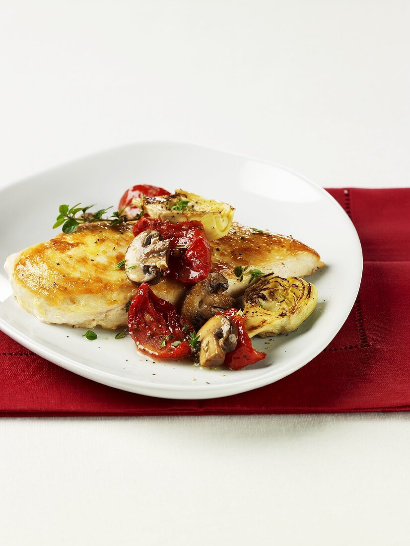Chicken breast with artichokes, dried tomatoes and mushrooms