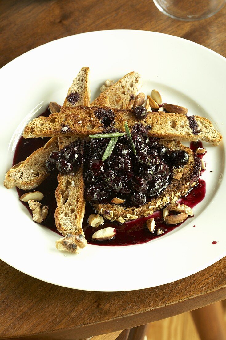 Toasted Slices of Baguette with Blueberry Sauce