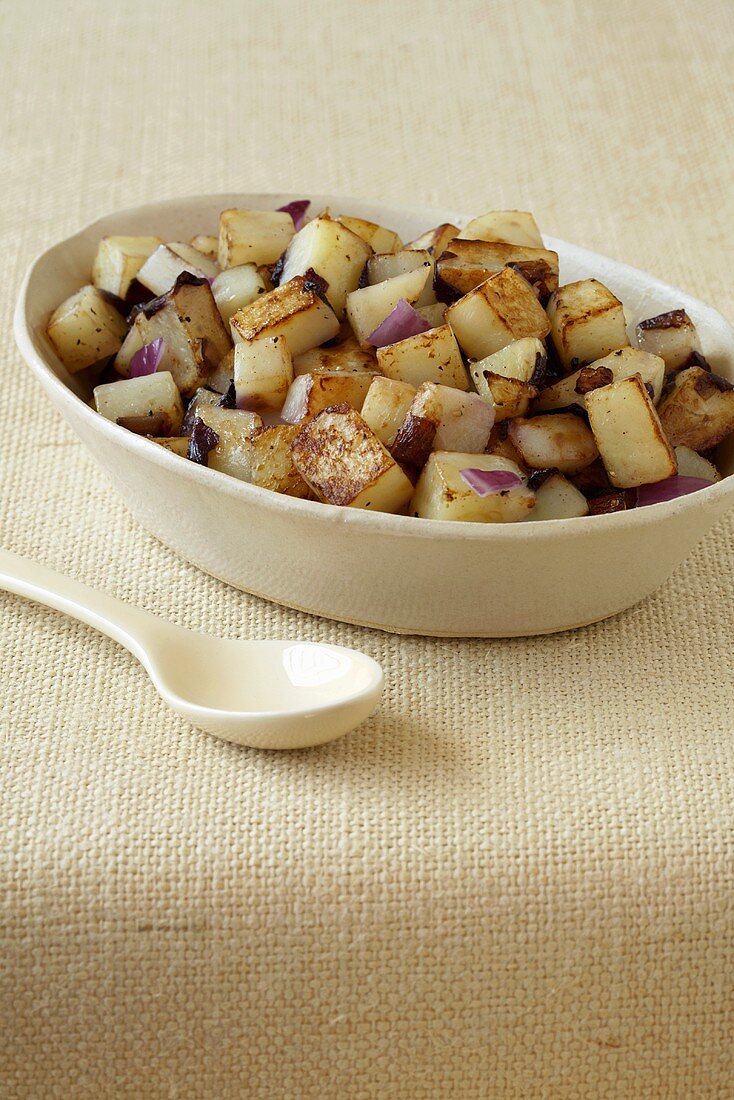 Serving Bowl of Sauteed Potatoes and Onions; Serving Spoon