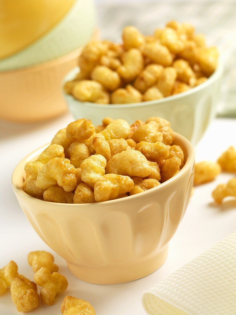 Two bowls of home-made caramel corn puffs