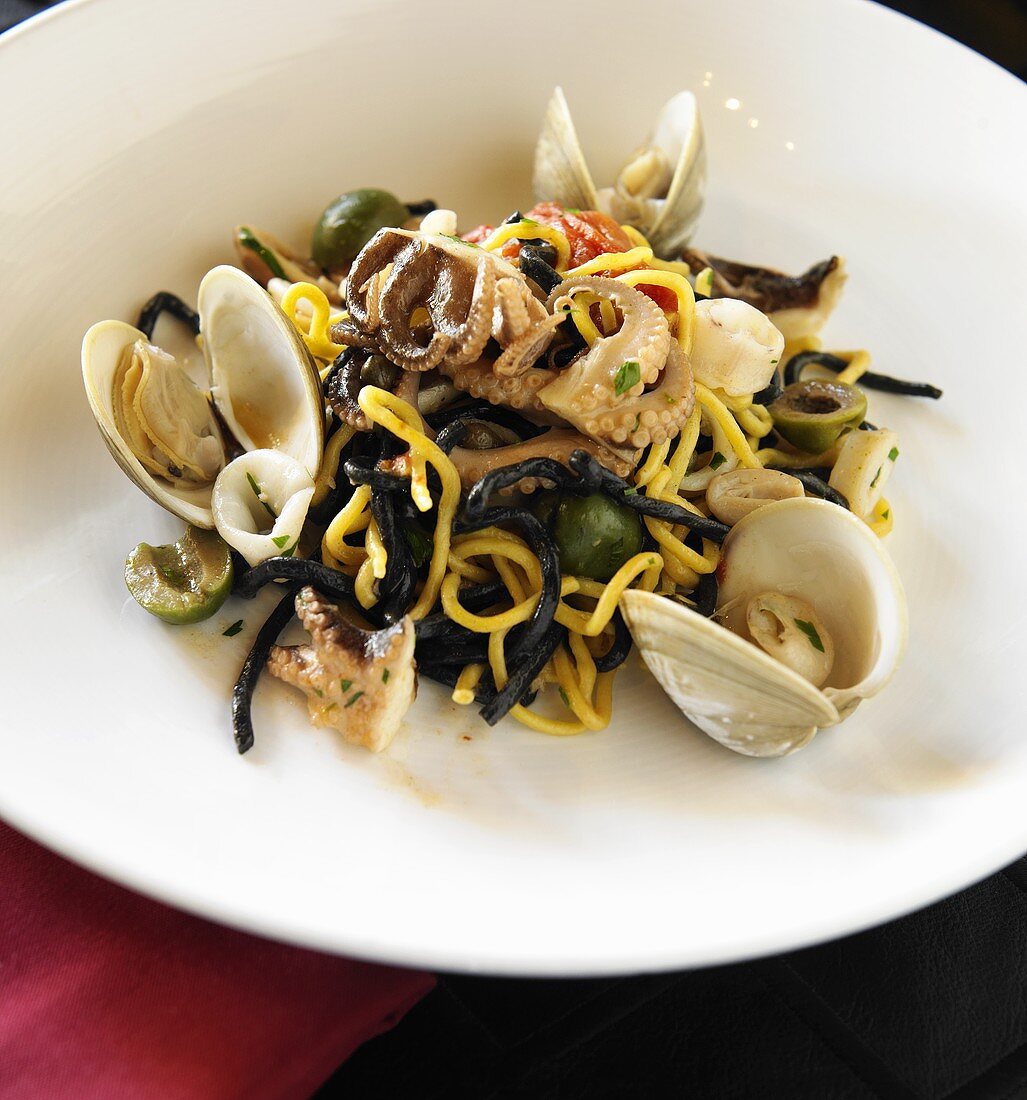 Squid Ink Pasta with Squid, Calamari, Clams, Tomatoes and Olives