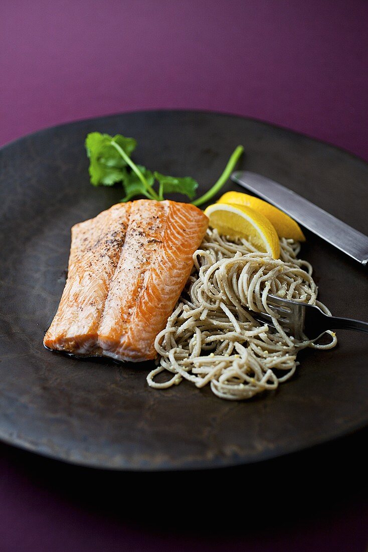 Arctic Char with Soba Noodles on a Black Plate
