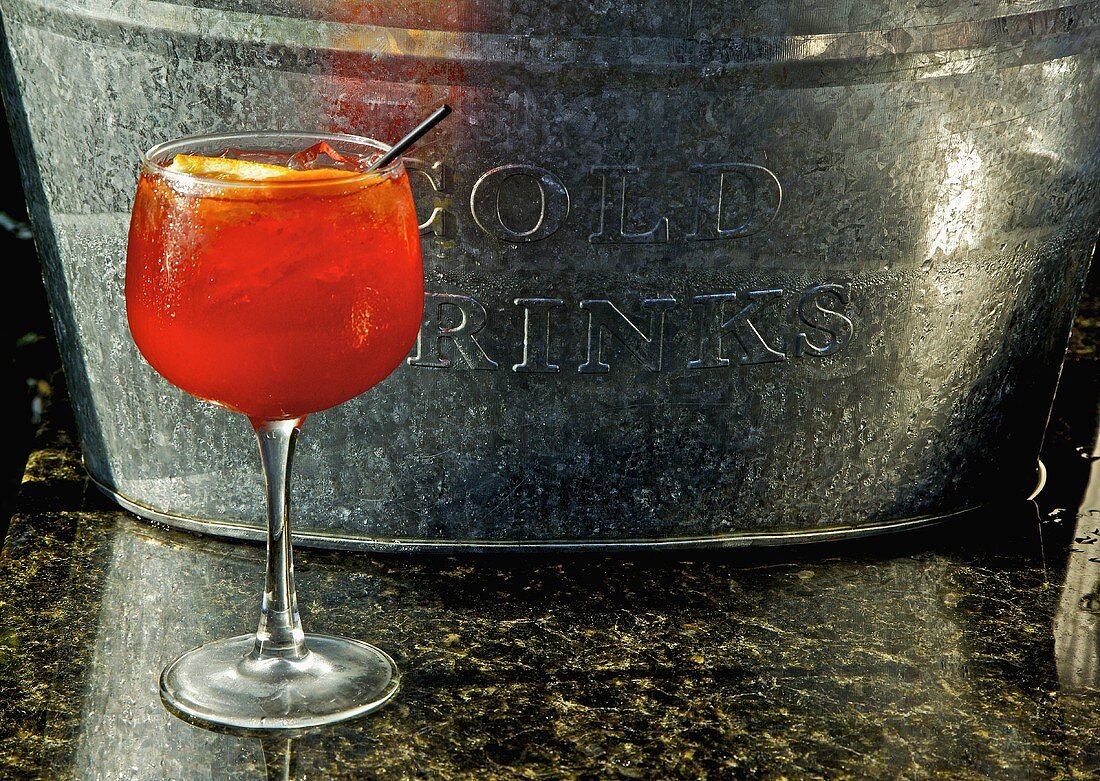 Sangria in a Stem Glass In Front of a Metal Ice Bucket