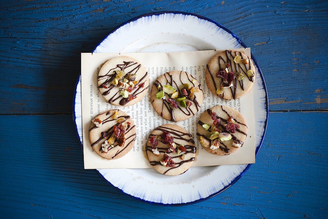 Cookies Topped with Pistachios, Dried Fruit and Chocolate Drizzles; From Above