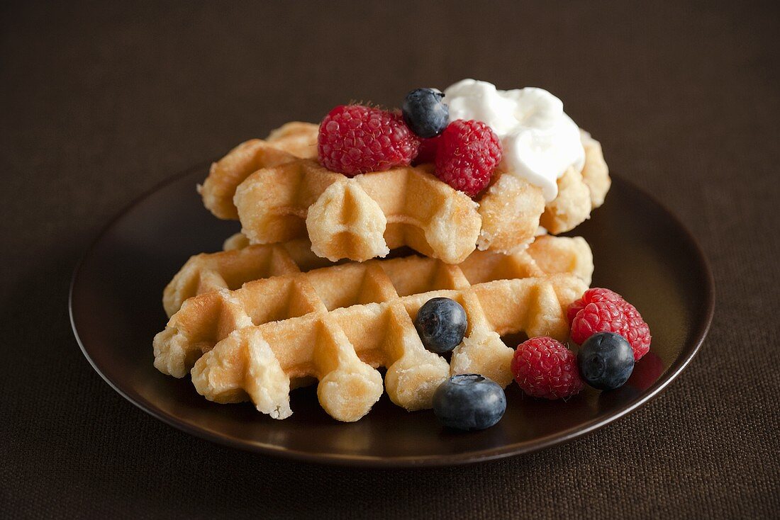Waffles with Blueberries and Raspberries and Whipped Cream