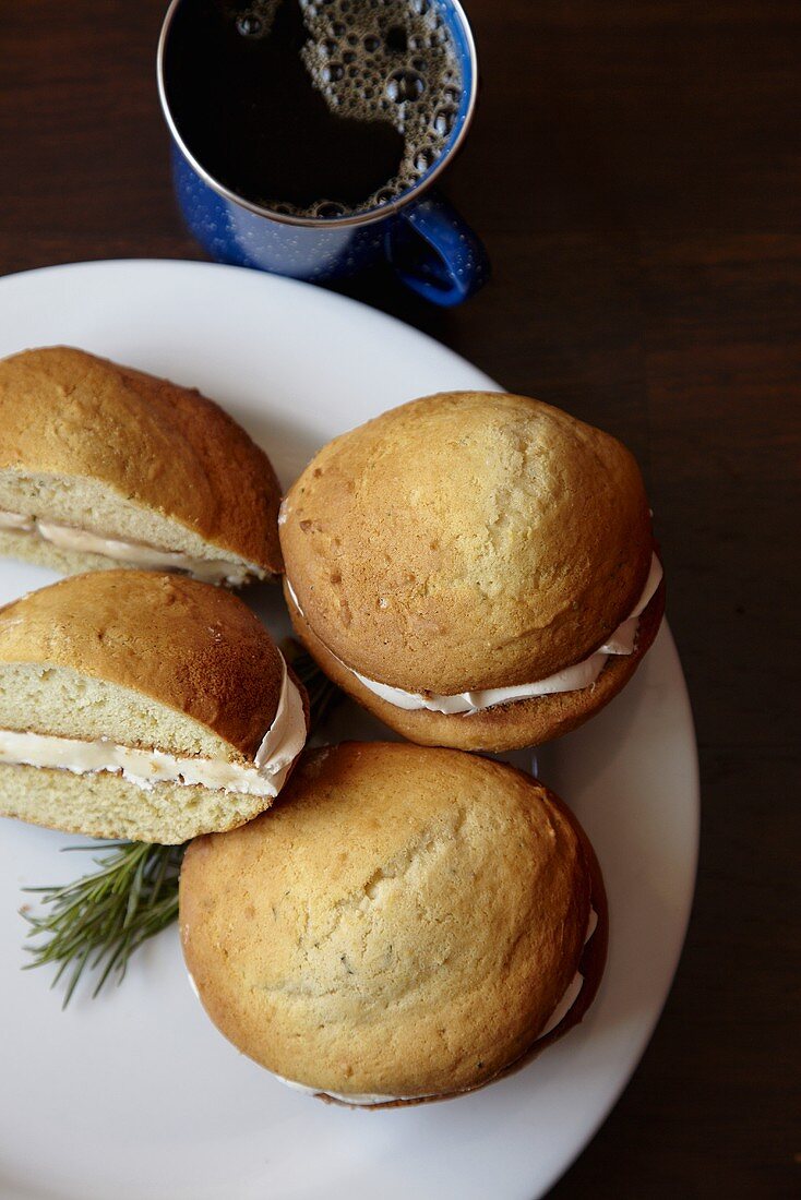 Rosemary Whoopie Pies with Lemon Cream Filling; On a Plate; With Coffee