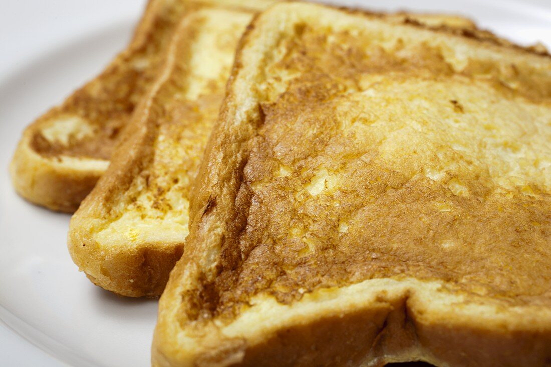 Three Pieces of French Toast on a Plate; Close Up