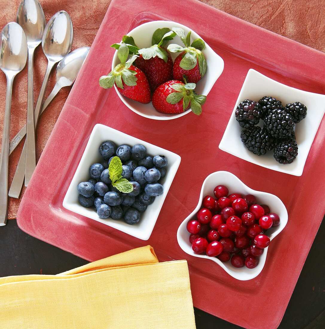 Four Bowls of Assorted Berries on a Tray; From Above