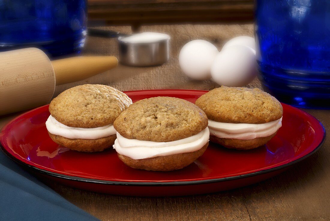 Three Banana Whoopie Pies on a Red Plate