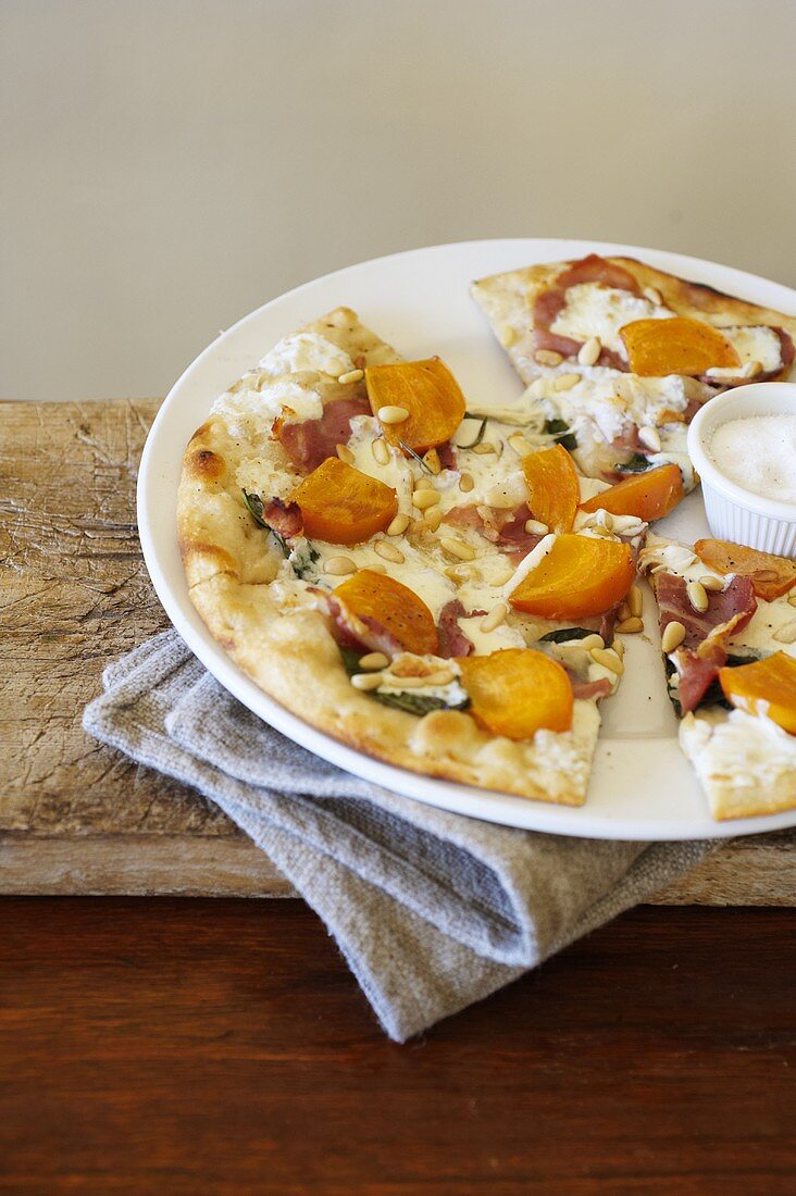 Persimmon, Prosciutto, and Pine Nut Pizza on a Plate