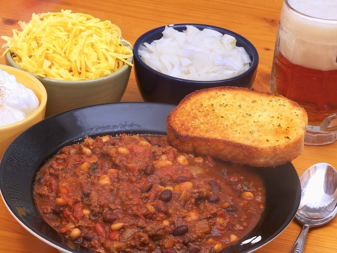 Venison chilli with three types of beans, garlic bread and beer