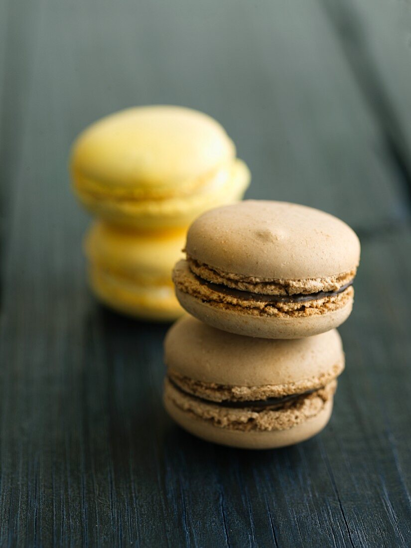 Two Chocolate Macaroons Stacked; Two Stacked Lemon Macaroons