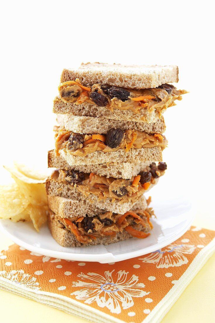 Peanut Butter, Carrot and Raisin Sandwiches on Wheat Bread; Stacked