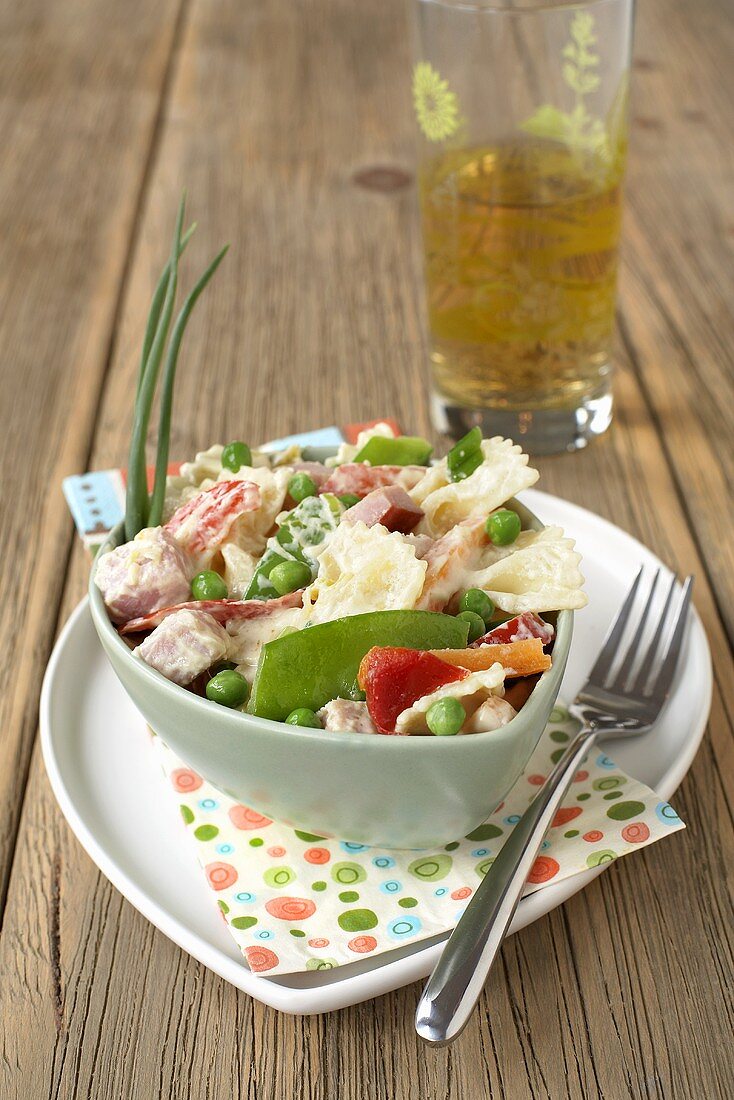 Farfalle with ham and vegetables